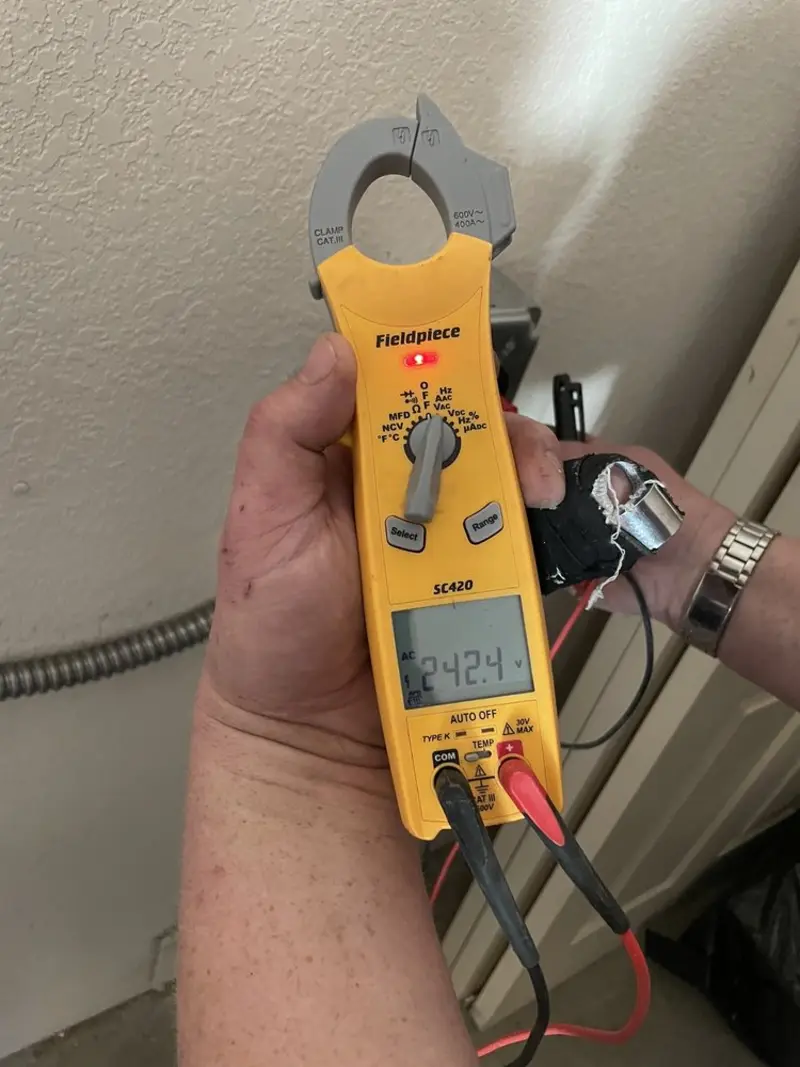 Voltage testing with clamp meter during Generator Installation in Independence